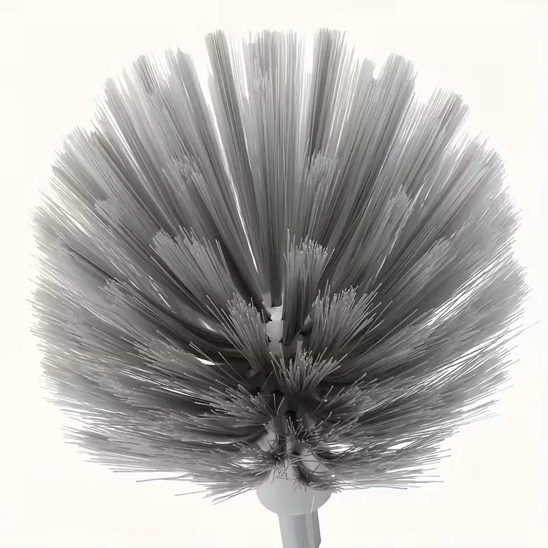 A close-up view of an adjustable length metal cleaning broom with numerous fine bristles.