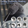 A black ceiling chandelier duster with a fluffy gray brush head and extendable handle.