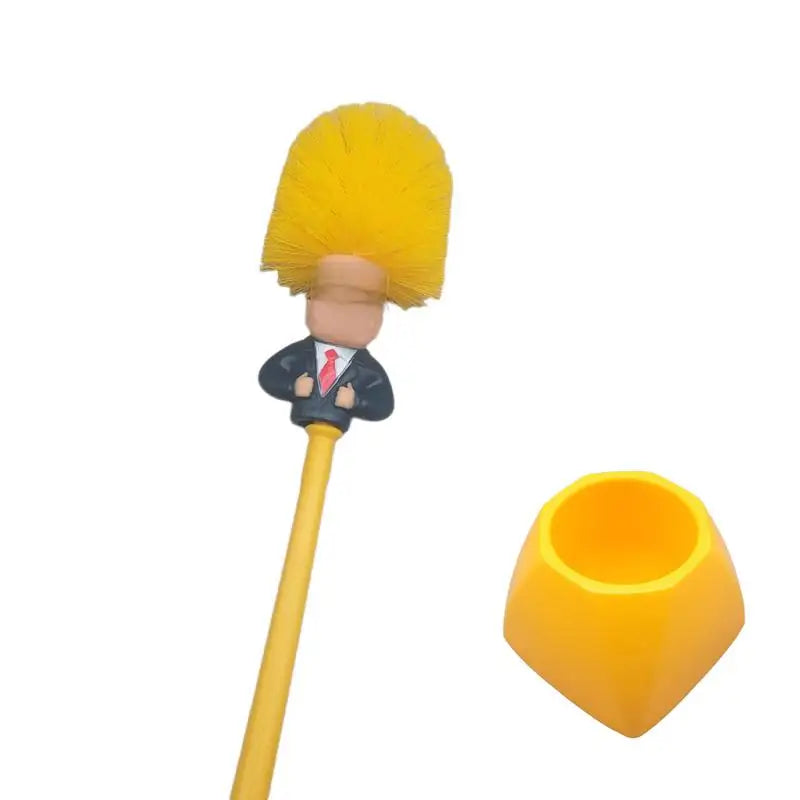 Gelbarer lustiger Toilettenschrubber mit blondem Kopf und schwarzem Griff.