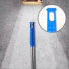 Close-up view of a blue extendable cobweb duster with an aluminum pole and a circular light fixture.