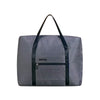 A dark gray foldable travel duffel bag with black straps and a zippered pocket on the front.