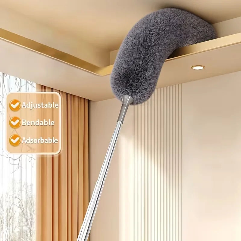 A silver telescopic duster with a fluffy gray head is shown hanging above a cabinet in a modern room.