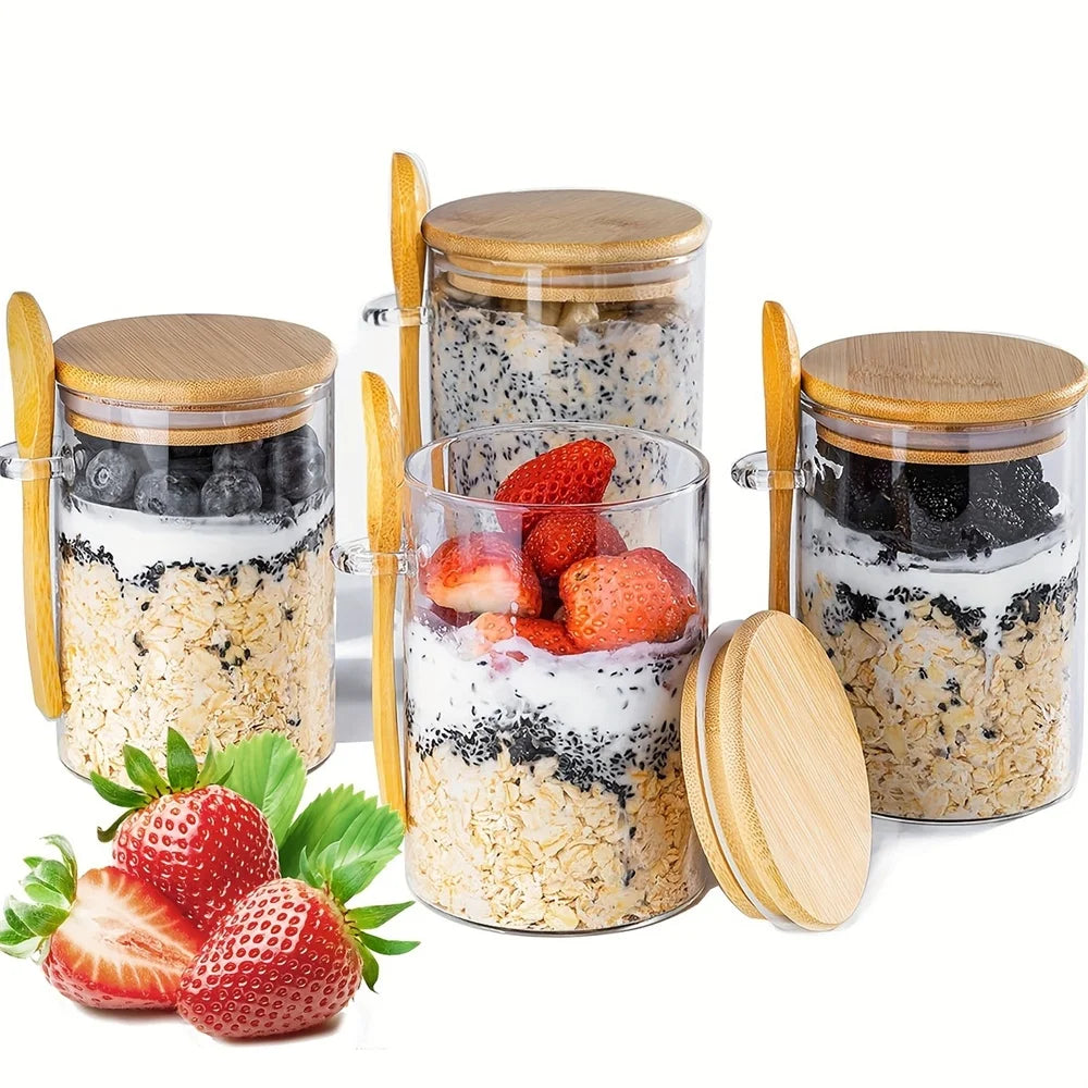 A set of airtight glass spice jars with bamboo lids filled with granola and fresh strawberries.