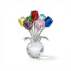 Crystal rose flower figurine with colorful glass petals arranged in a clear glass vase