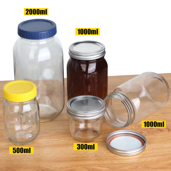 A set of four glass mason jars with lids of various sizes, labeled 2000ml, 1000ml, 500ml, and 300ml, displayed on a wooden su