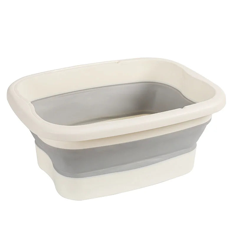 Collapsible foot soak bucket with massage dots in white and gray.