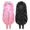 A pair of satin sleep bonnets, one pink and one black, designed for curly hair.