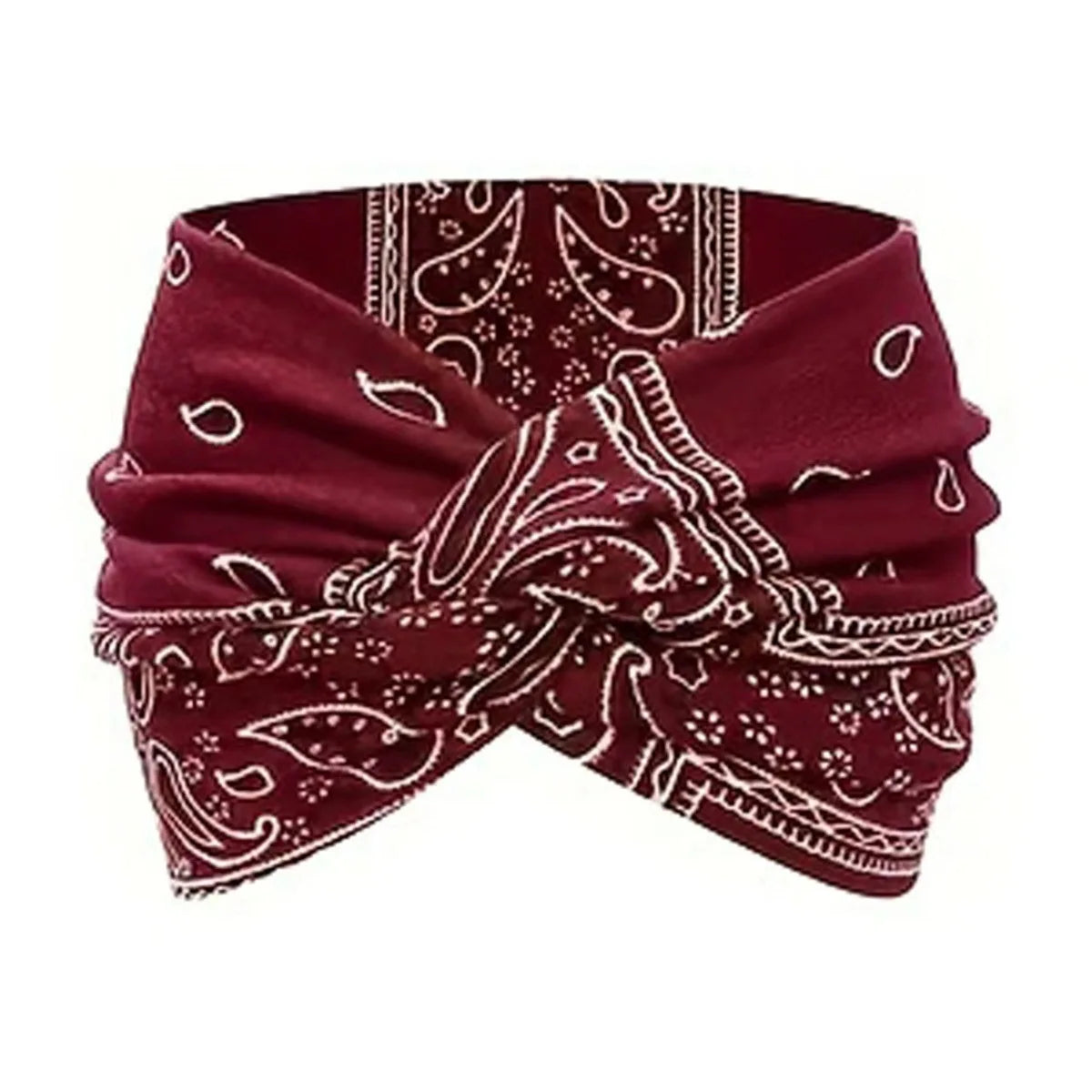 A maroon elastic knot yoga and fitness headband with white paisley patterns.