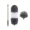 Extendable cobweb duster featuring a long aluminum pole and a fluffy gray and white brush head.