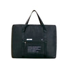 Black foldable travel duffel bag with a handle and luggage sleeve