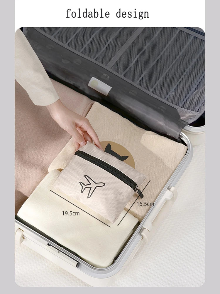 A beige foldable travel duffel bag is shown inside a gray suitcase, demonstrating its design.