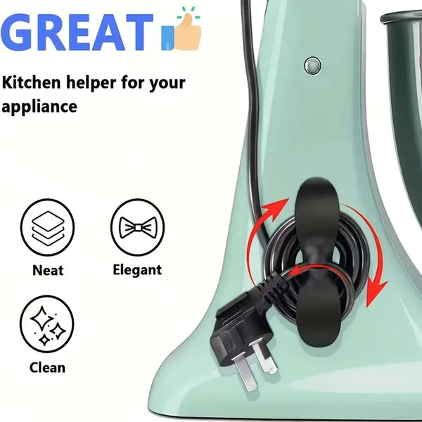 A black adhesive cord organizer is shown attached to a light green kitchen appliance.