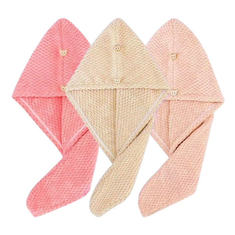 Three folded pink and beige microfiber hair towel wraps displayed together