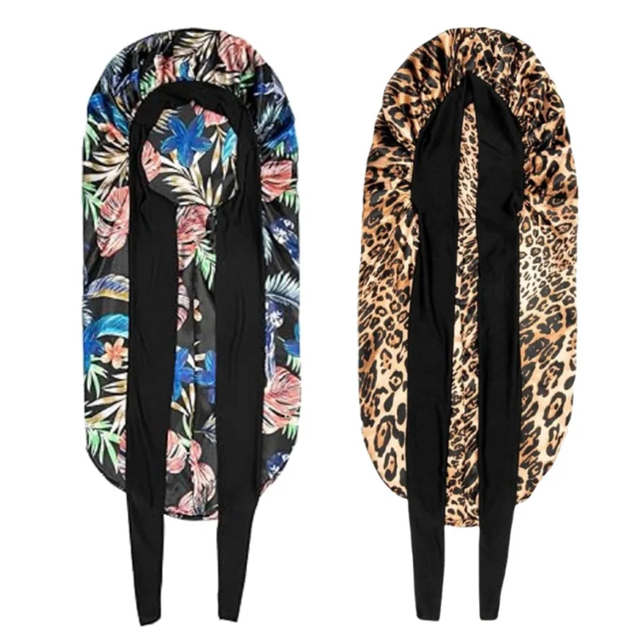 A satin sleep bonnet for curly hair shown in black and floral leopard print patterns.