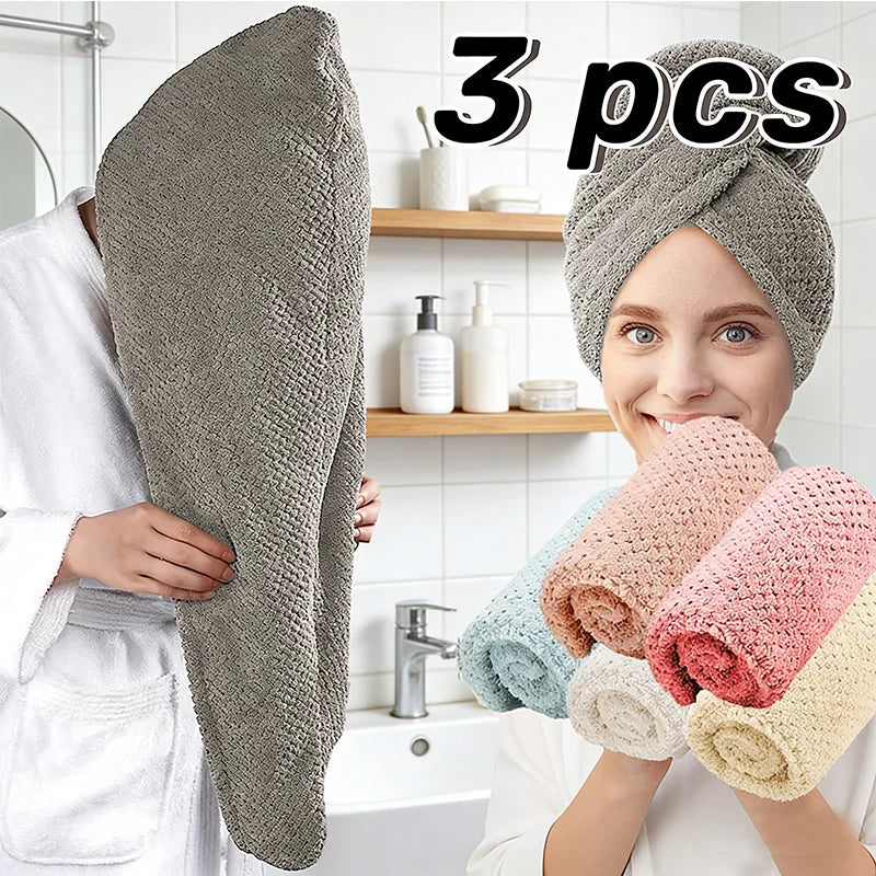 Three gray microfiber hair towel wraps shown being held by a woman in a bathroom setting.