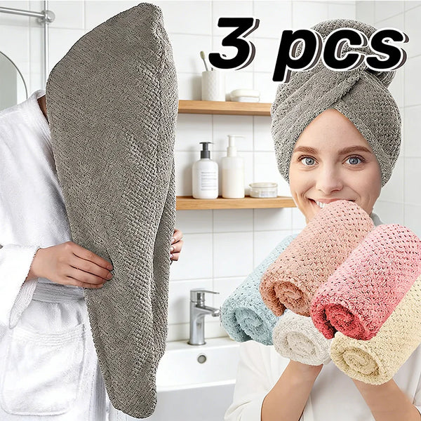 Three gray microfiber hair towel wraps shown being held by a woman in a bathroom setting.