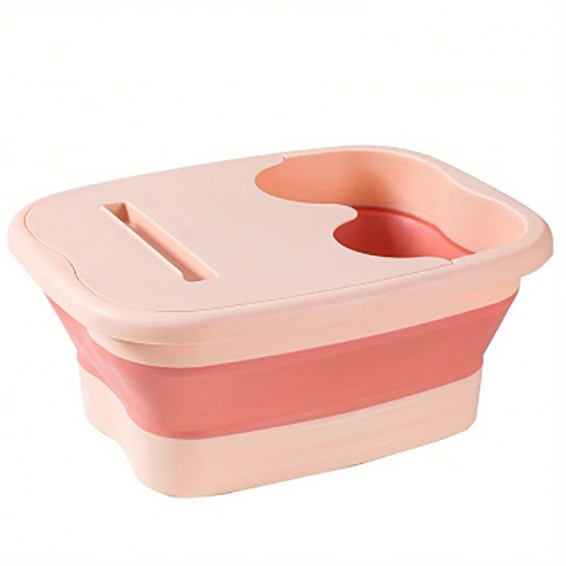 A pink collapsible foot soak bucket with massage dots.