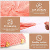 A pink waffle weave microfiber hair towel wrap showing its soft texture, firm sewing, and double button closure.