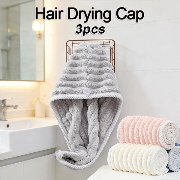 A set of three gray microfiber hair drying caps or towels displayed on a white surface.