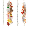 A collection of fluffy, stuffed animal charms hanging from a bohemian cotton storage chain.