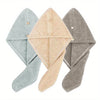 Three folded quick-dry microfiber hair towel wraps in light blue, beige, and gray.