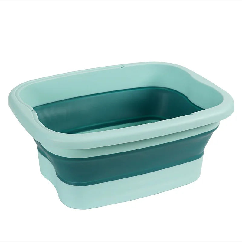 A light teal collapsible foot soak bucket with a darker teal interior and exterior.