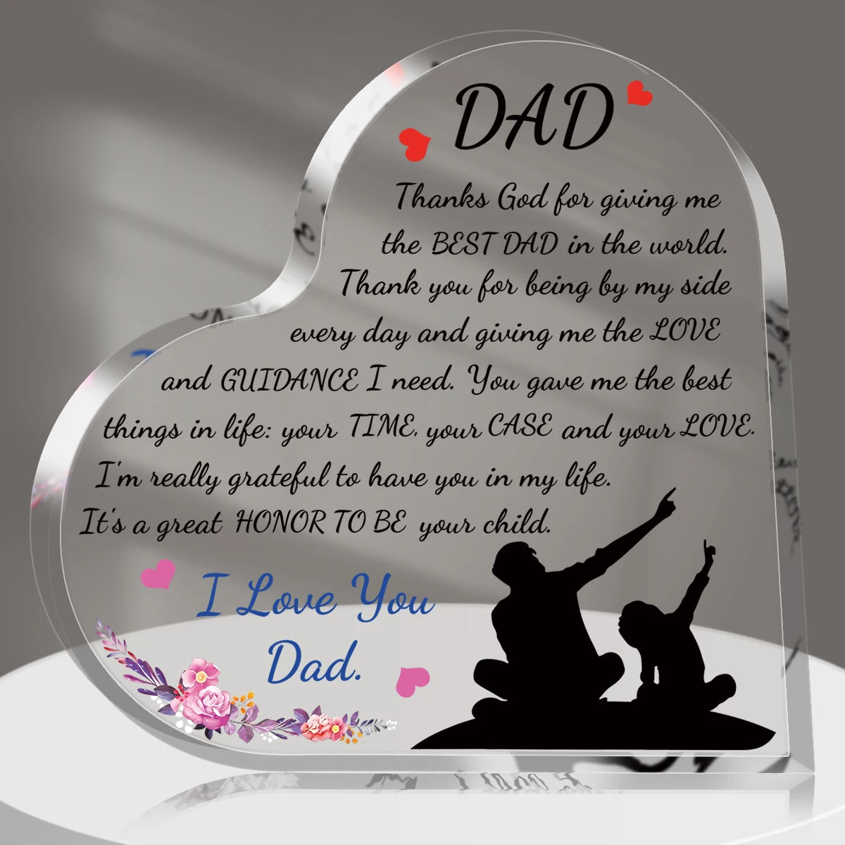 A heart-shaped acrylic keepsake plaque for Father's Day with a silhouette of a father and child.