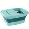 A light blue collapsible foot soak bucket with massage dots.
