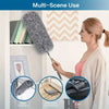 A woman is using an extendable microfiber duster for multi-scene cleaning on curtains, furniture, and cars.