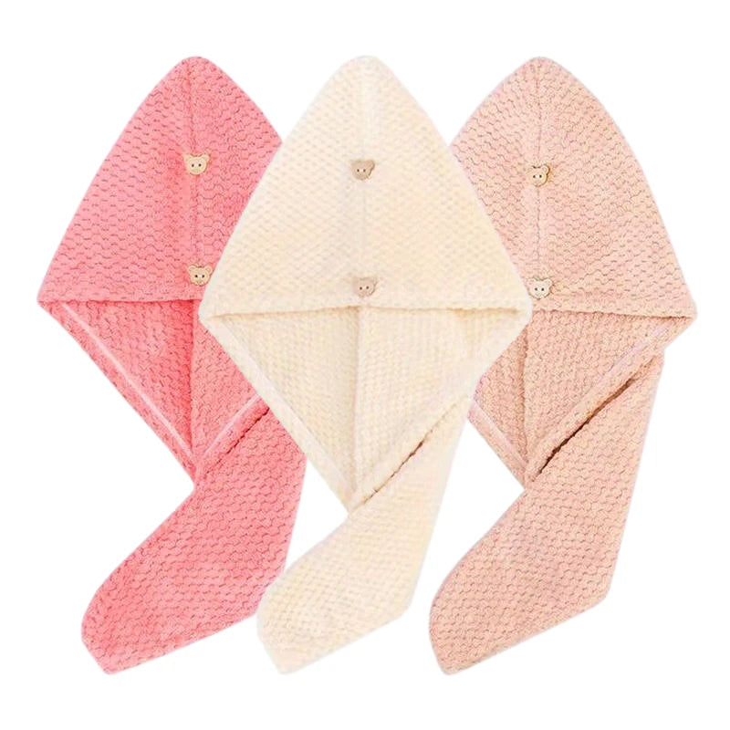 Three folded pink and beige microfiber hair towel wraps displayed together.