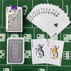A green felt surface displays a deck of poker playing cards, including a King of Spades, a Joker, and several numbered cards.