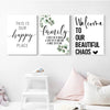 Three framed canvas prints featuring happy family quotes and green leaves for wall decor