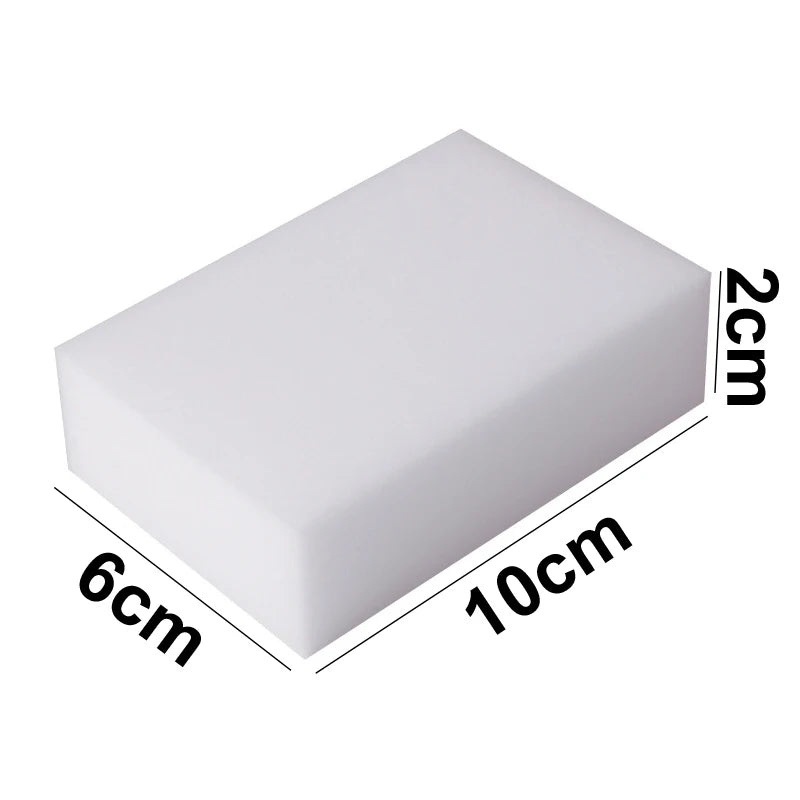 A rectangular white melamine foam cleaning sponge with dimensions 10cm by 6cm and a thickness of 2cm.