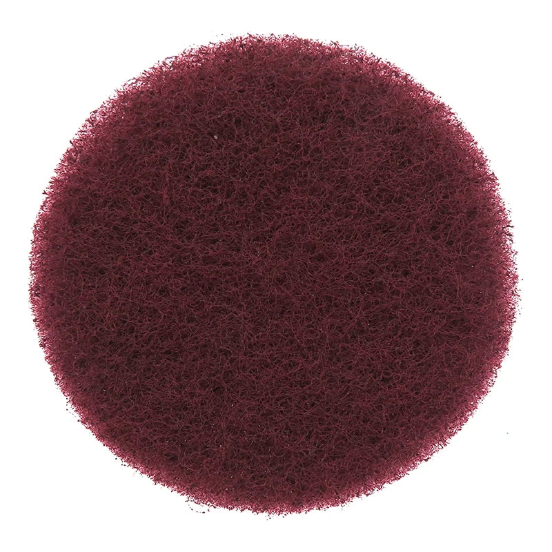 A circular image of a deep reddish-brown, fibrous scouring pad product.
