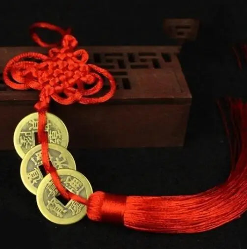 Handmade red knot feng shui coins for prosperity with a tassel