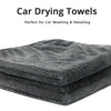 A stack of dark gray ultra-soft microfiber car drying towels.