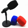 A black foam microphone windscreen with a stand and two colored silicone windscreens, blue and red.