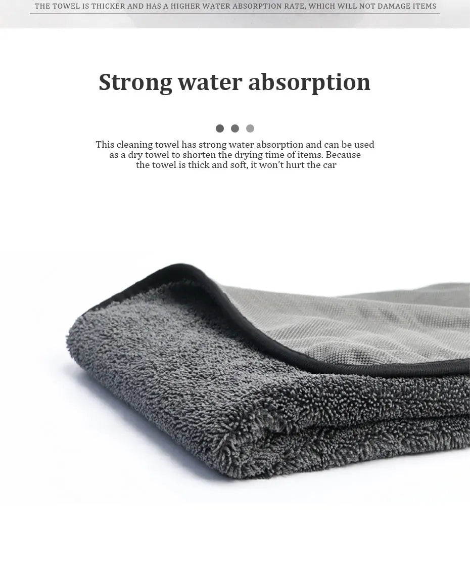 A stack of dark gray microfiber cleaning towels used for drying items.