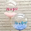 A set of clear latex balloons, one pink and one blue, with text reading Its a Girl! and Its a Boy!