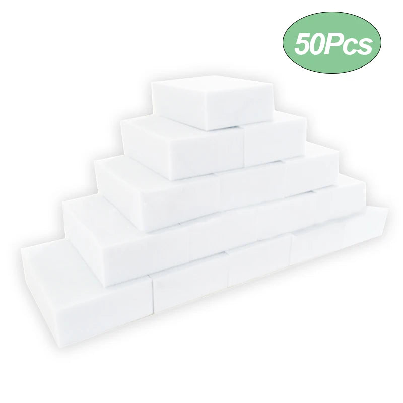 A stack of fifty white melamine foam cleaning sponges.