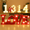 Red alphabet and number LED lights spelling out LOVE