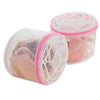 A pink reusable mesh bag used for washing lingerie or delicate items.