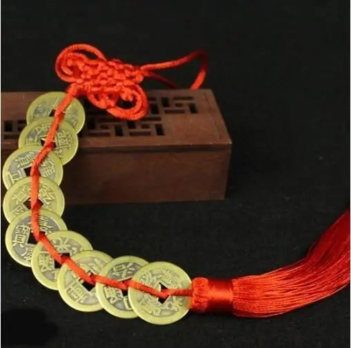Handmade red knot feng shui coins for prosperity on a string