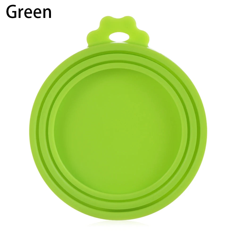 A bright green silicone reusable food storage lid or cover.