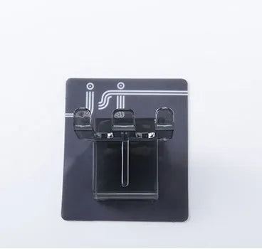 A black wall mounted organizer with slots for cups and toothbrushes.