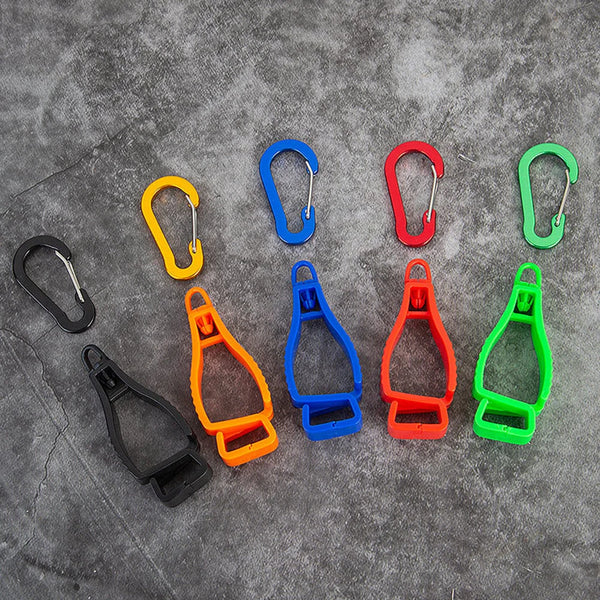 A collection of colorful durable glove clips and buckles arranged on a gray surface.