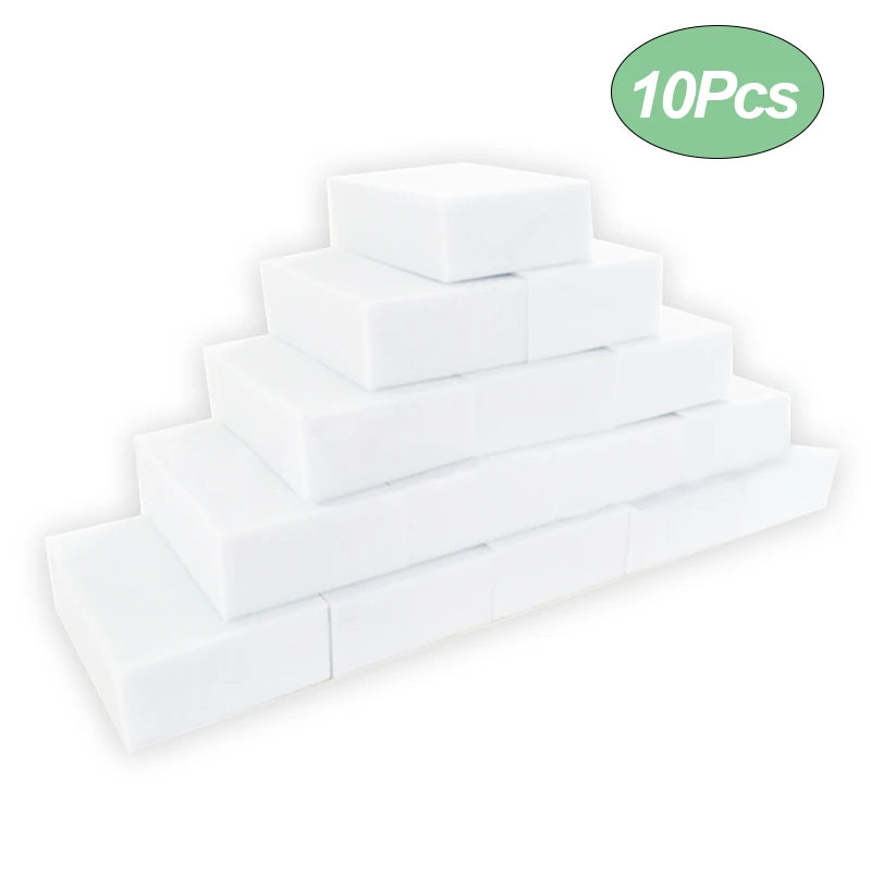 A stack of ten white melamine foam cleaning sponges.
