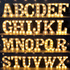 A display of individual letter LED lights spelling out the English alphabet in gold color.