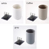 A multi-use wall mounted cup and toothbrush organizer in white, coffee, and gray colors.