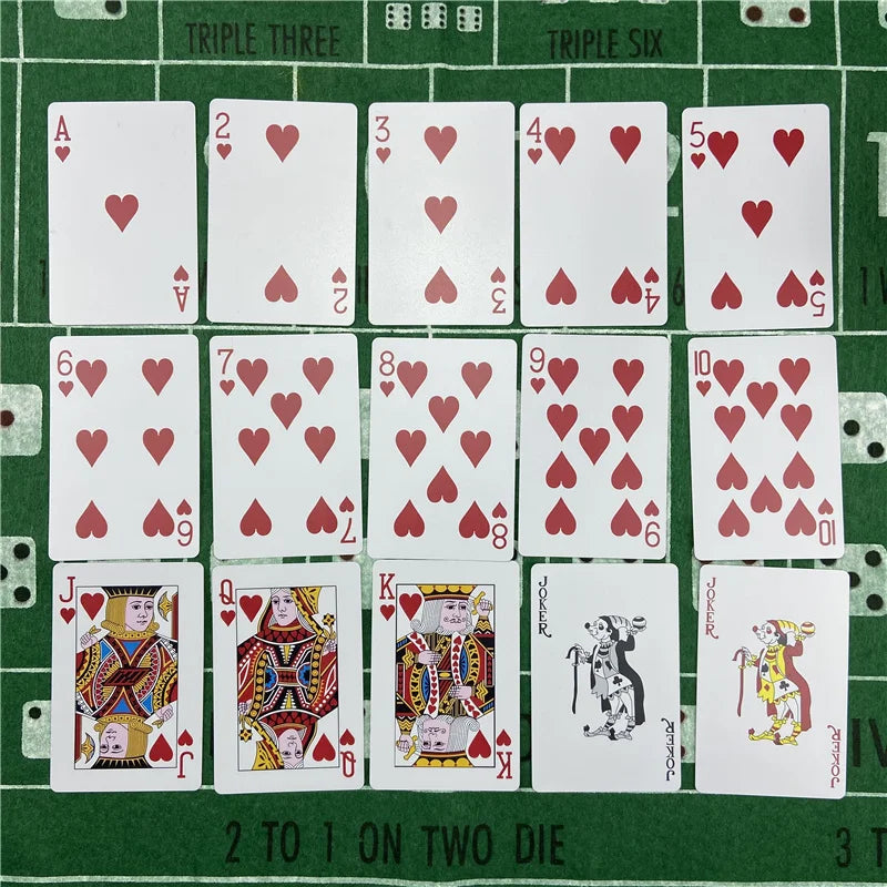 A set of poker playing cards arranged in a grid, showing various face cards and numbered cards.